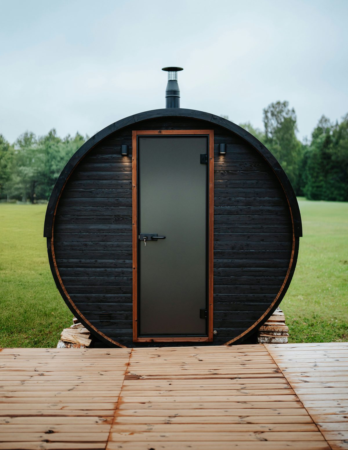 Barrel sauna with chimney outdoors