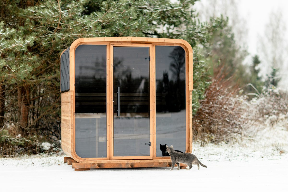 Outdoor sauna covered in snow in winter